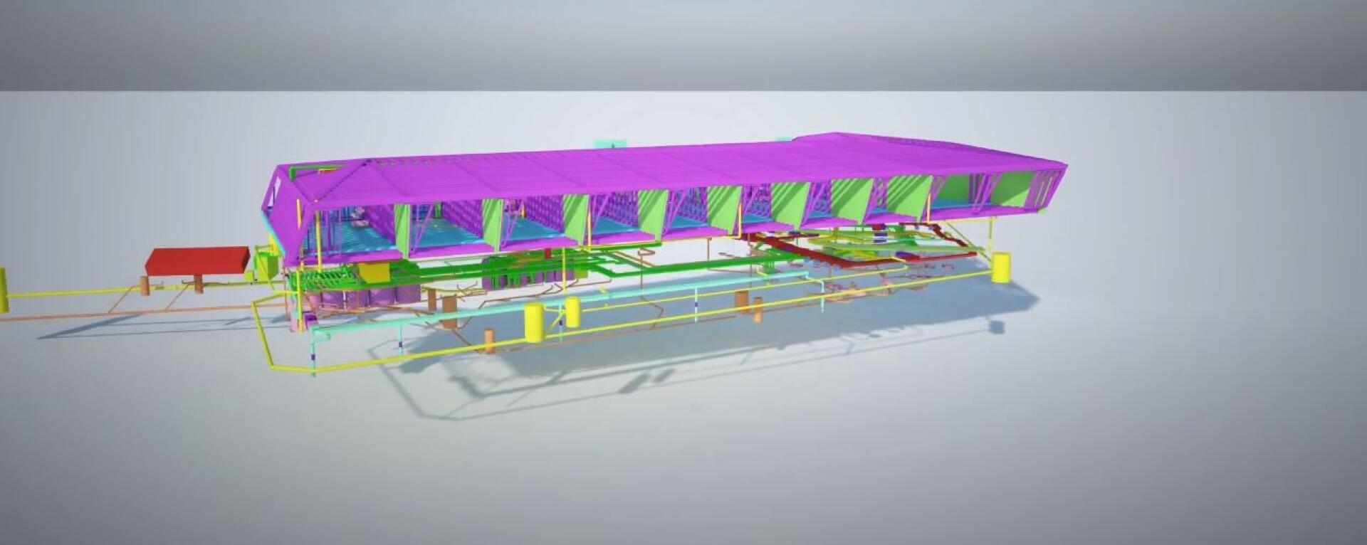 3D-Modell eines rechteckigen Industriegebäudes mit lilafarbenem Dach und grünen Seitenwänden, das detaillierte interne Komponenten und das Gerüst in verschiedenen Farben auf einem hellen Hintergrund zeigt.